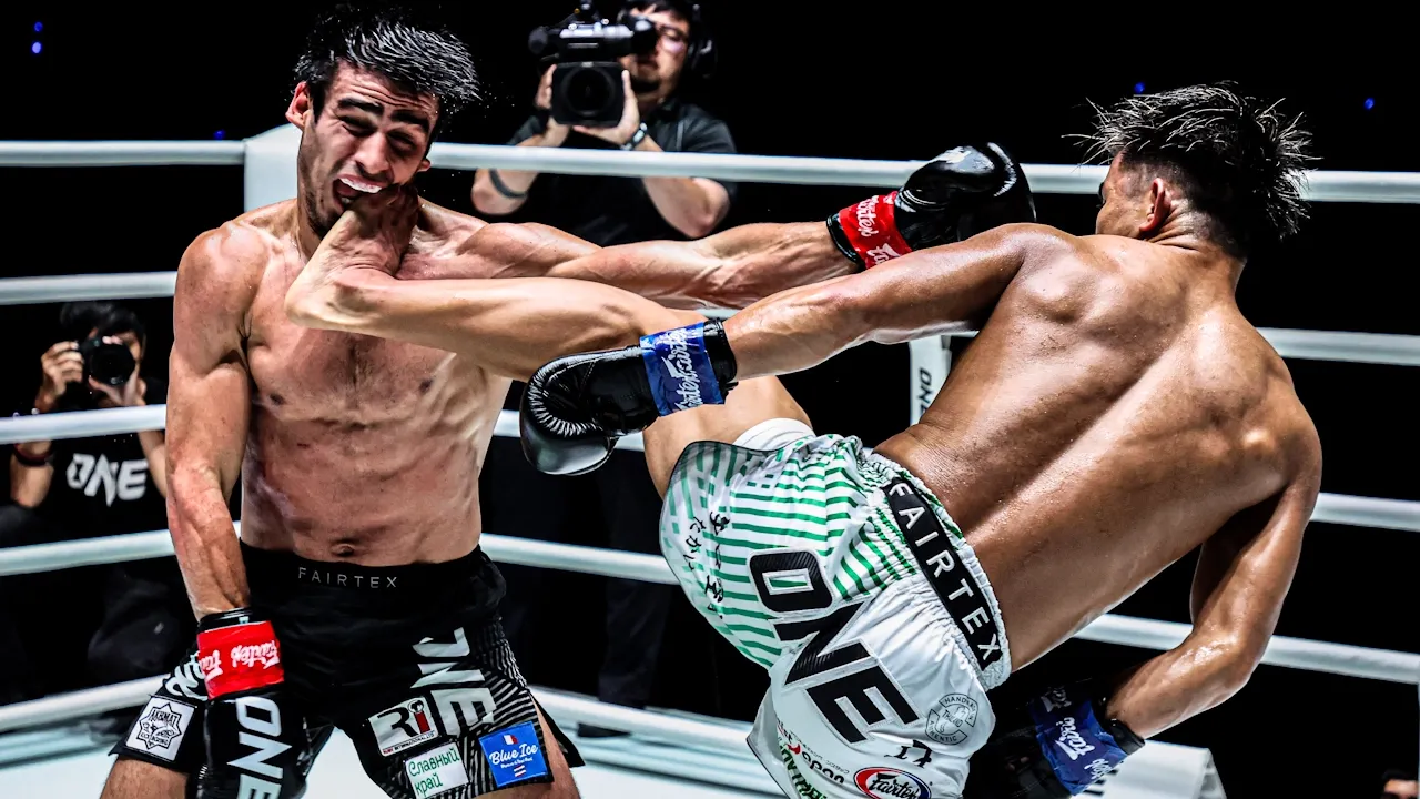Yuki Yoza lands a front kick.